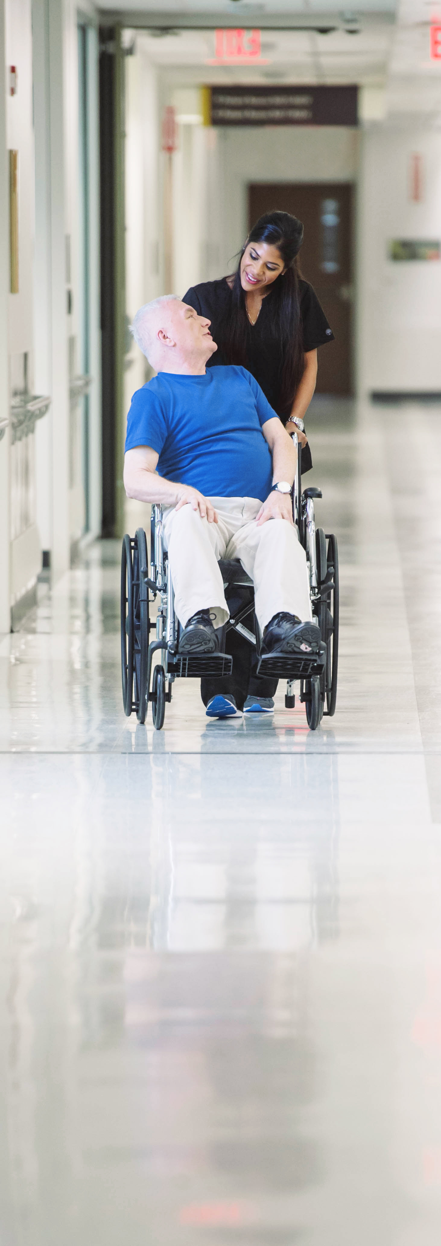 Male Patient in Wheelchair with Nurse 2016_2INSIDE Lakeland Regional
