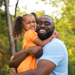 father and daughter hugging