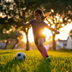 child playing soccer