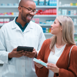 pharmacist talks with woman